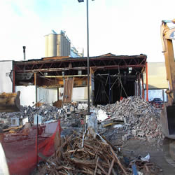 DCC Performing the demolition of the Monticello IGA