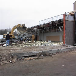 DCC performing the demolition of the Monticello IGA 