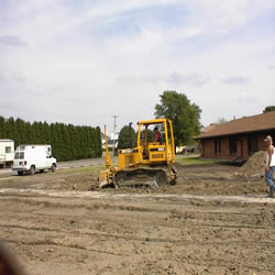 DCC performing the demolition of the Monticello IGA